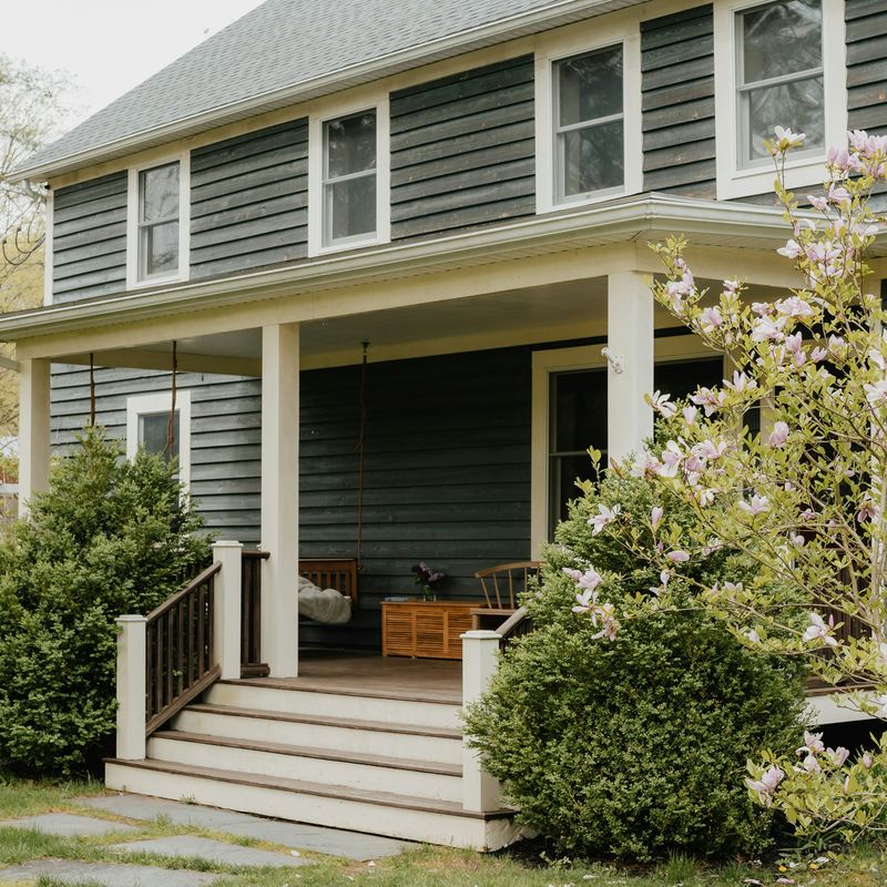 A house with a covered porch and front steps